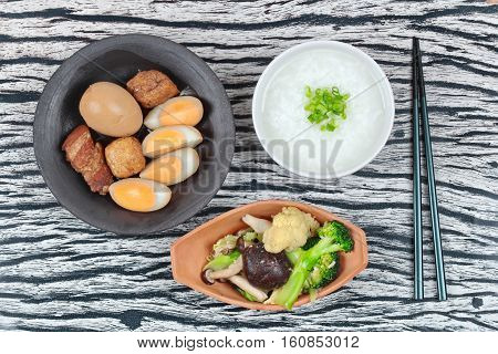 Rice Gruel And Stewed Boiled Egg  And Fried Vegetables.
