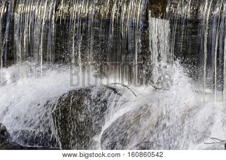 Small waterfall tumbling onto Saugatucket River rocks