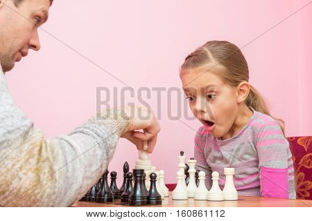 My Daughter Was Surprised And Opened Her Mouth When Dad Killed Another Piece On The Chessboard