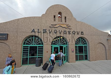ALBUQUERQUE NEW MEXICO - OCTOBER 9 2016: Passengers from the Southwest Chief line with luggage enter the Amtrak train station from the platform near the tracks in Albuquerque New Mexico.