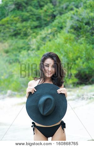Happy Woman Enjoying Beach Relaxing Joyful In Summer By Tropical Blue Water. Beautiful Bikini Model
