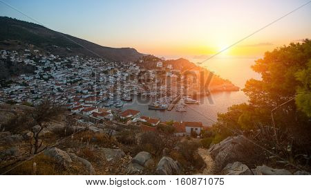 Hydra island in the setting sun, Aegean sea, Greece.