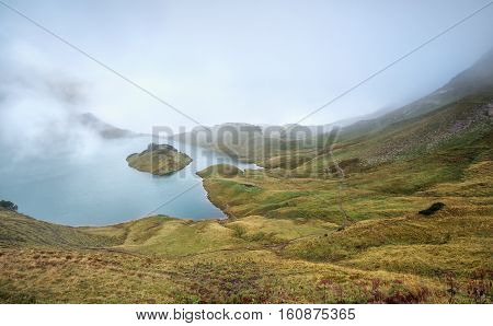 foggy morning on alpine lake Schrecksee Germany