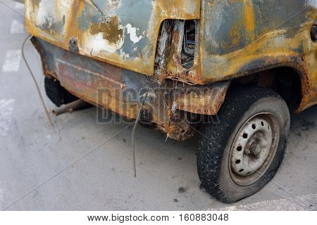 the rear of the burned-out compact car