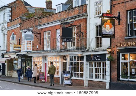 Farnham/UK. 10th December 2016. Shops and retail facilities in a historic central Farnham Street attract day trippers on a cold December day. People are walking along The Borough.