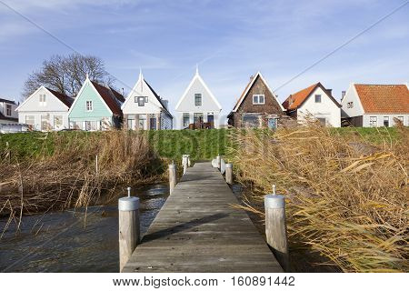 Durgerdam, Netherlands, 22 november 2016: jetty and old wooden houses on the dike of durgerdam near amsterdam in the netherlands