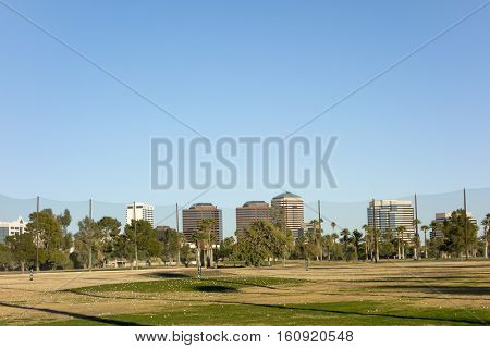 Golf course white balls spread all over grass in Encanto par Phoenix downtown Arizona in Winter; Copy space