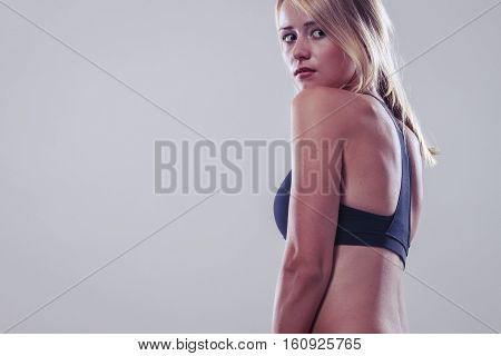 Sport training gym and lifestyle concept. Woman in sporstwear black bra doing fitness exercises