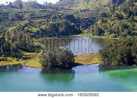 The Color Lake.
This Lake is appropriately named Telaga Warna due to a natural phenomenon that causes the water of the lake to change in fluctuating colors. At times it is green, yellow, purple or even taking the colors of the rainbow. This phenomenon occ