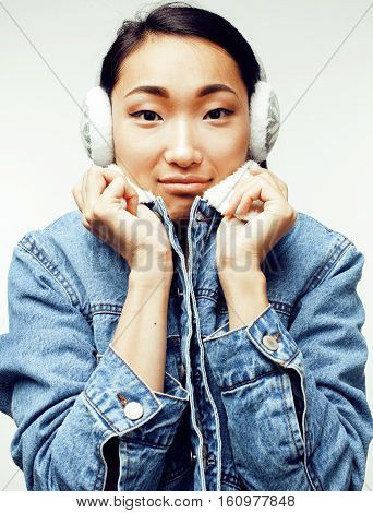 young pretty asian modern fashion hister woman in winter earphones posing cheerful emotional isolated on white background, lifestyle people concept close up