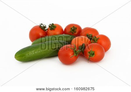 On white & copy space fresh healthy cherry tomatoes and cucumber stock pictures