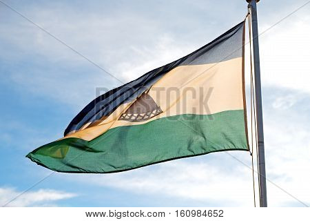In The Cloudy Sky Waving Flag