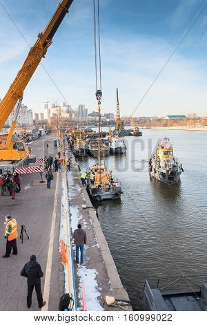 MOSCOW, RUSSIA - NOVEMBER 11, 2016: State Unitary Enterprise Mosvodostok performs recovery vessels on coastal winter parking. The water area of the river port on the Moscow River.