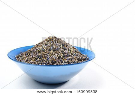 Dried lavender organic tea in wooden spoon Isolated on white background. On left side