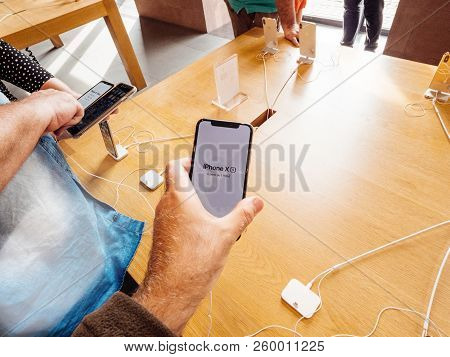 Strasbourg, France - Sep 21, 2018: Apple Store With Curious Customers People Hands Buying Holding Ad