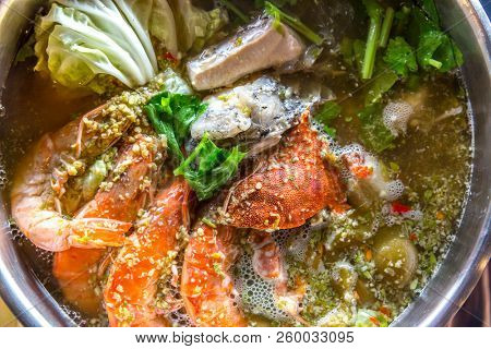 Seafood spicy hot pot crab prawn fish squid tumyum