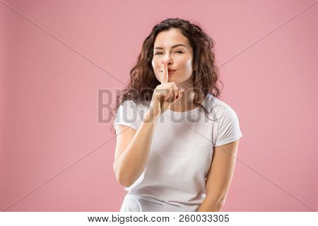 Secret, Gossip Concept. Young Woman Whispering A Secret Behind Her Hand. Business Woman Isolated On 