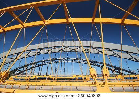 Bright Yellow Bridge Named Hogeweidebrug Over The Amsterdam-rhine Canal In Utrecht For Traffic In Th