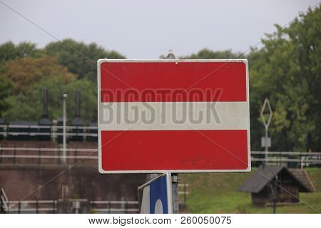 Red And White Sign For Ships Which Means No Entry On This Side At River Hollandsche Ijssel In Gouda,