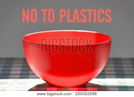 Closeup Of A Plastic Bowl On The Table And Text No To Plastics