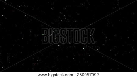 Flying Dust Particles On A Black Background