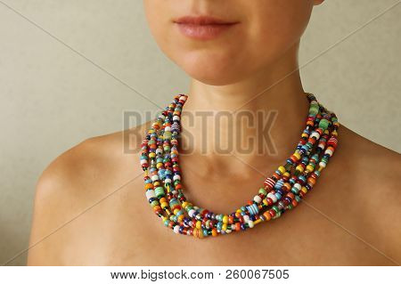 Bright Beads Of Murano Glass On A Young Girl