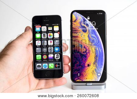 Paris, France - Sep 25, 2018: Male Hand Compare New Iphone Xs And Xs Max Smartphone Model By Apple C