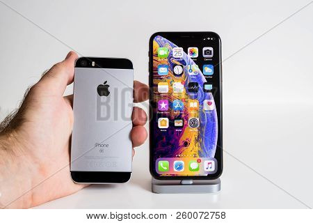 Paris, France - Sep 25, 2018: Male Hand Compare New Iphone Xs And Xs Max Smartphone Model By Apple C