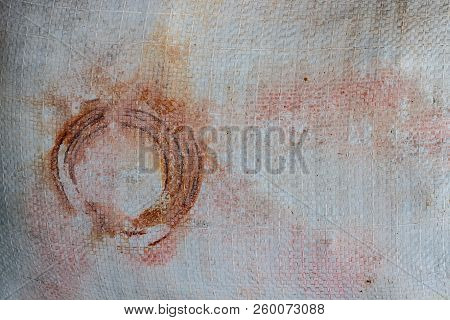 Old White Tarp With Circular Rust, Stains, A Gunge Vintage Look In Shades Of Red, Orange Color, Brow