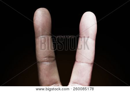 Photography Idea Showing A Black And White Finger Making A Peace Sign Against Racism.