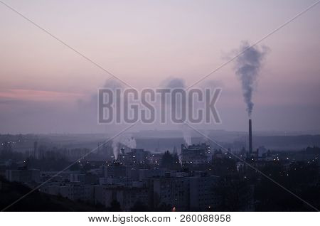 The City Wakes Up Under The Morning Fog And The Chimneys Smoke