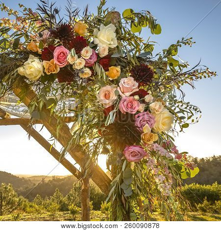 Spectacular Flowers On A Wooden Huppah Sunset