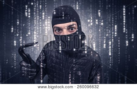 Burglar in action with encoded concept and his tools in his hand. 