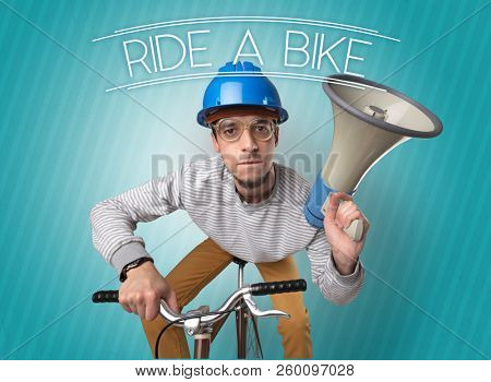 Kooky young guy on a bike with cyclist keywording and streaky background