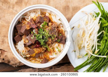 Northern Thai Food (kanom Jeen Nam Ngeaw) With Vegetables On Wooden Background,spicy Rice Noodles So
