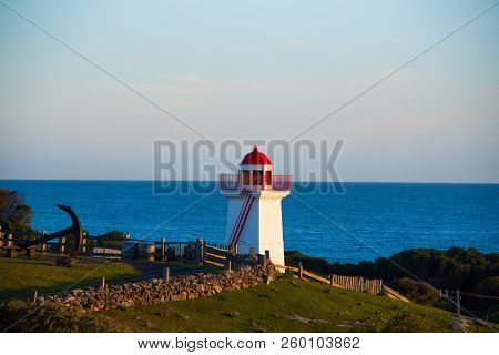 Lady Bay Lighthouse In A Meadow With An Anchor Overlooking The Sea, Warrnambool, Victoria, Australia