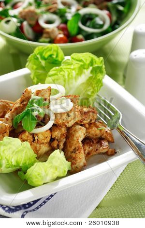 Chicken stripes with salad