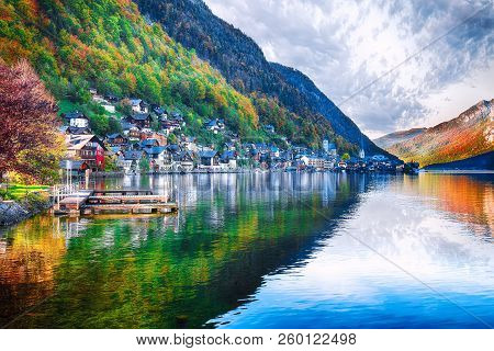 Scenic View Of Famous Hallstatt Mountain Village With Hallstatter Lake. Sunny Autumn Sunrise On Hall