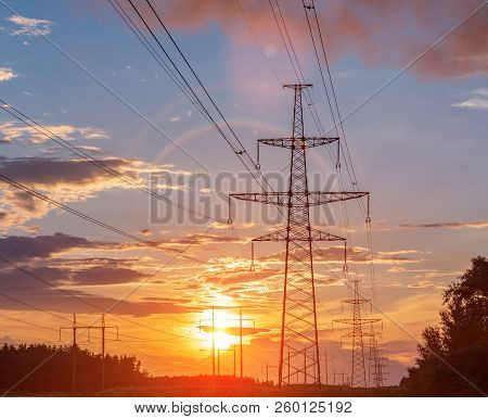 High Power Electricity Poles In Urban Area. Energy Supply, Distribution Of Energy, Transmitting Ener