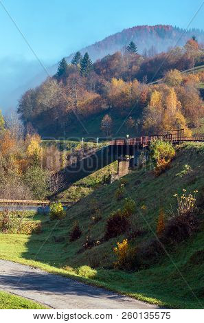 Autumn Carpathian Mountains Misty Landscape With  Railroad Bridge And Village Outskirts (rakhiv Dist