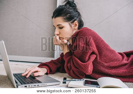 Side View Young Brunette Woman Sufring On Internet Using Laptop Managing Domestic Budget, Making Not