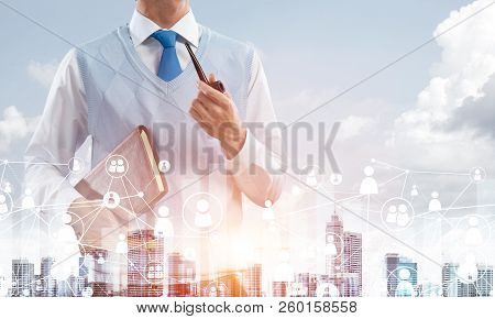 Double Exposure Of Confident And Young Businessman In Smart-casual Wear Smoking Pipe And Modern City