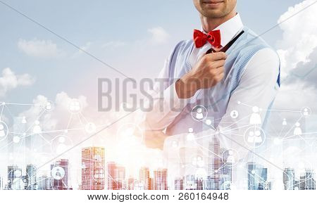 Double Exposure Of Confident And Young Businessman In Smart-casual Wear Smoking Pipe And Modern City
