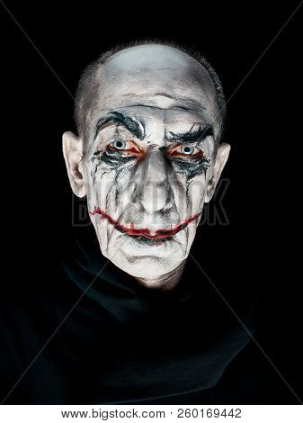 Bloody Halloween Theme: The Crazy Maniak Face On Dark Studio Background