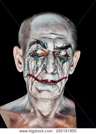 Bloody Halloween Theme: The Crazy Maniak Face On Dark Studio Background
