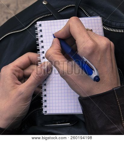 Hands Write A Letter. In Hand A Pen For Writing. Clean Sheet Of Notebook.