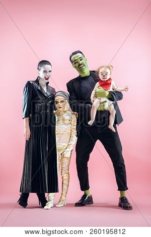 Halloween Family. Happy Father, Mother And Children Girls In Halloween Costume And Makeup. Bloody Th