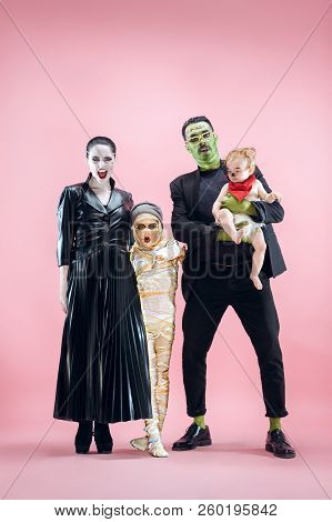 Halloween Family. Happy Father, Mother And Children Girls In Halloween Costume And Makeup. Bloody Th