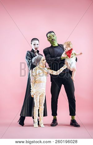 Halloween Family. Happy Father, Mother And Children Girls In Halloween Costume And Makeup. Bloody Th
