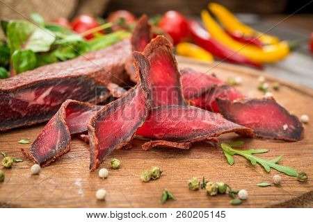 Armenian Basturma. Beef Cured And Spice. Organic Products On A Wooden Table